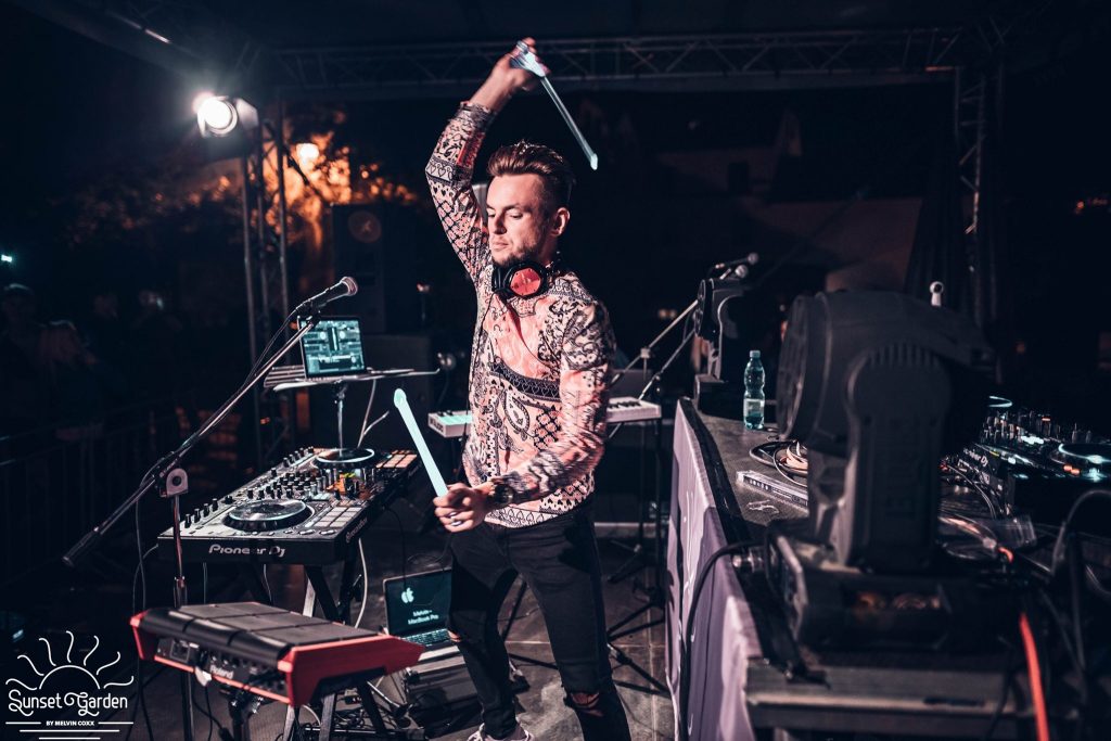 DJ Václav Brom getting the crowd dancing at an evening party on stage
