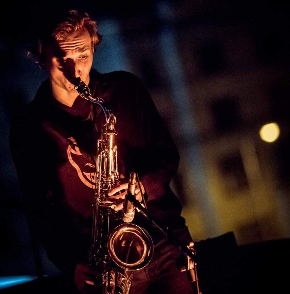 Saxophonist Kryštof Janáček playing in the evening light – saxophonist for corporate events